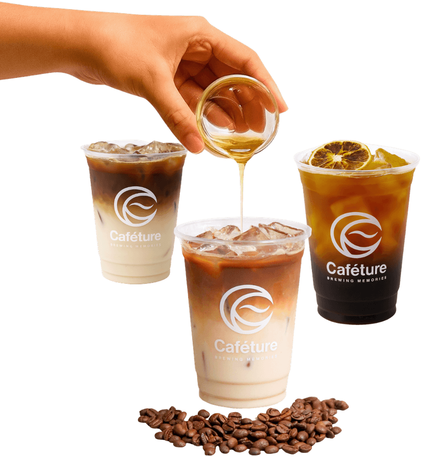 Three iced Caféture drinks with coffee beans